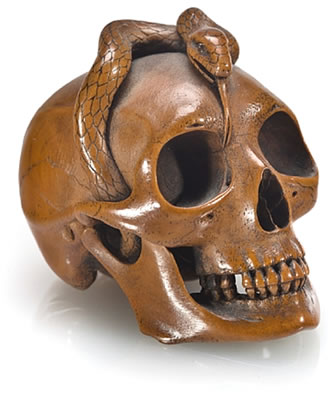 Hokyudo Itsumin : A wood netsuke of a snake on a skull