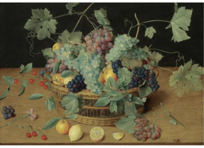 Isaak Soreau : A STILL LIFE WITH FRUIT IN A BASKET, INCLUDING BUNCHES OF GRAPES AND LEMONS, CHERRIES AND ORANGES ON THE WOODEN TABLE BENEATH