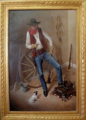 William Ewing III : Portrait of a cowboy sitting on a wagon wheel in a barn and holding a lariat