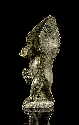 Eyeetsiak Peter : A serpentine carving of a bird with raised wings